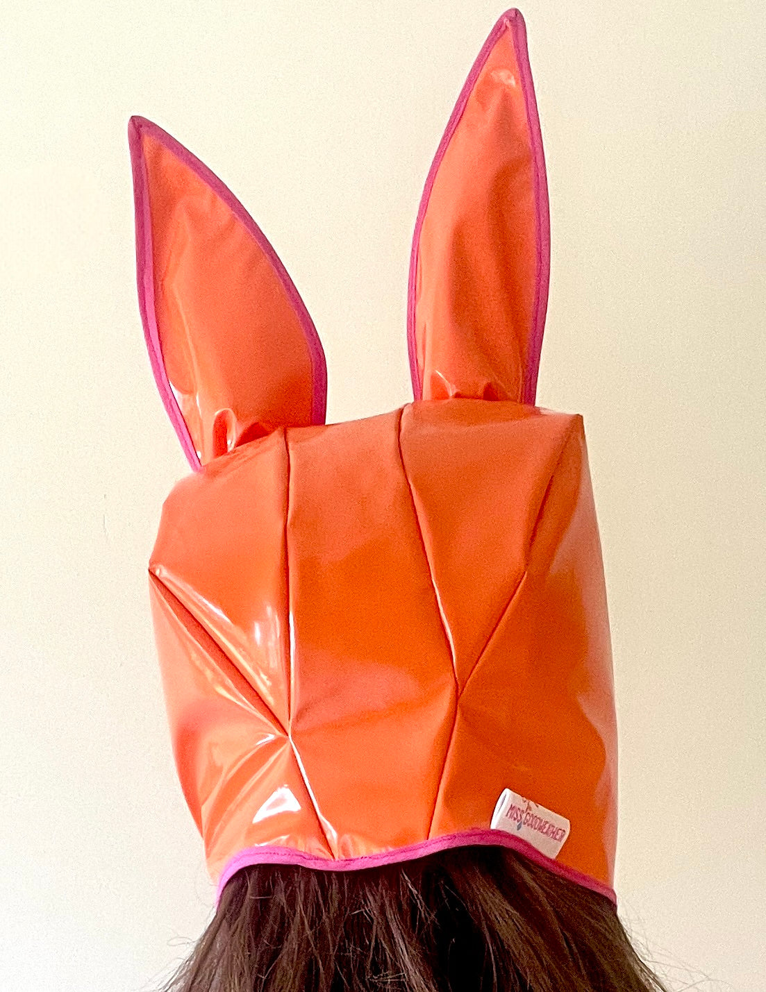 ANIMORPH Bunny Hood: orange/geometric print. Waterproof