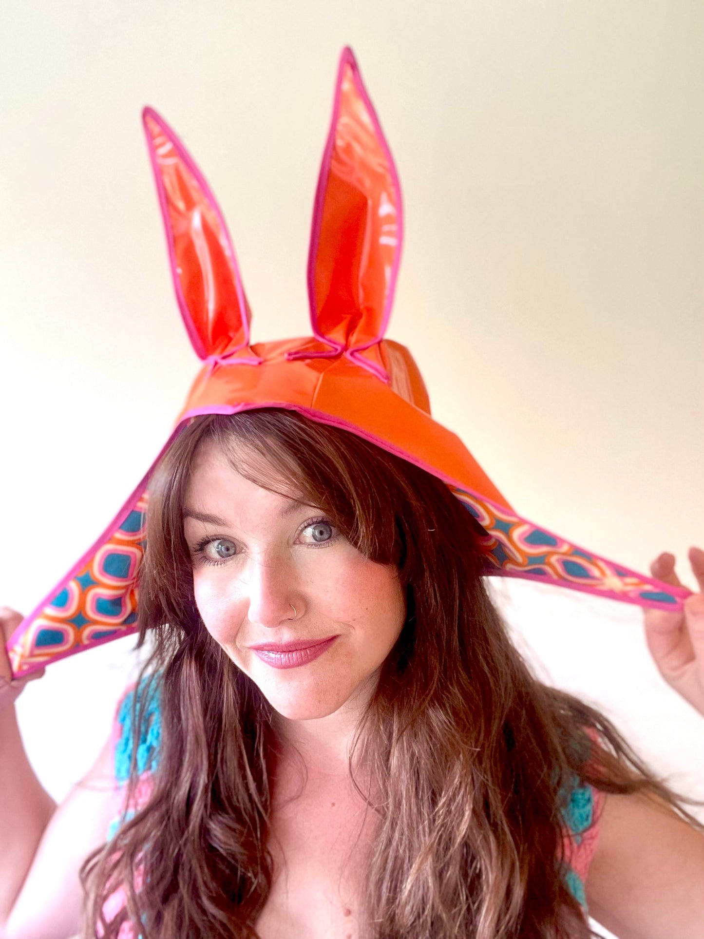 ANIMORPH Bunny Hood: orange/geometric print. Waterproof