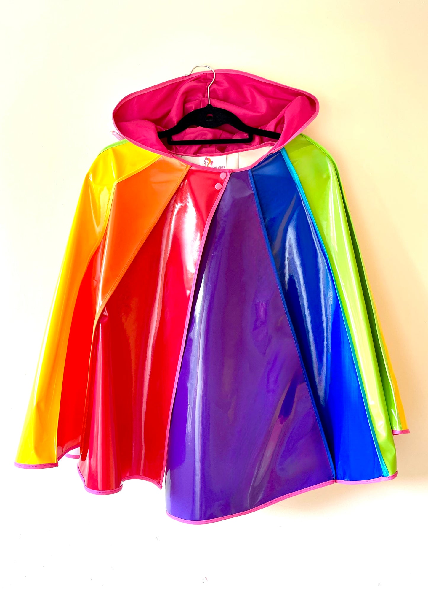 PRIDE cape: water-resistant cape. Feat. progress pride flag colours and intersex symbol.