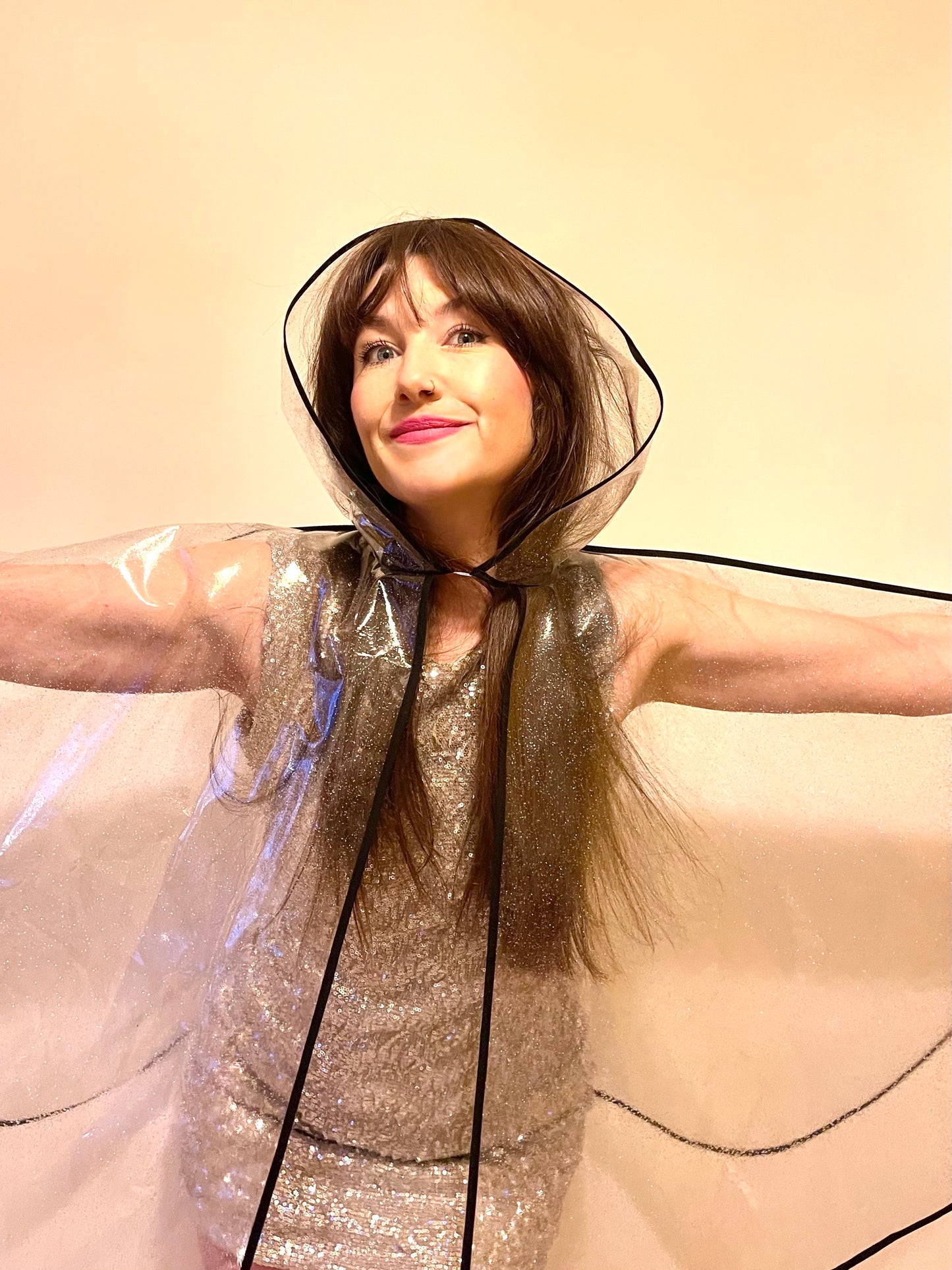 Mid-length NUDIE glitter cape: BLACK