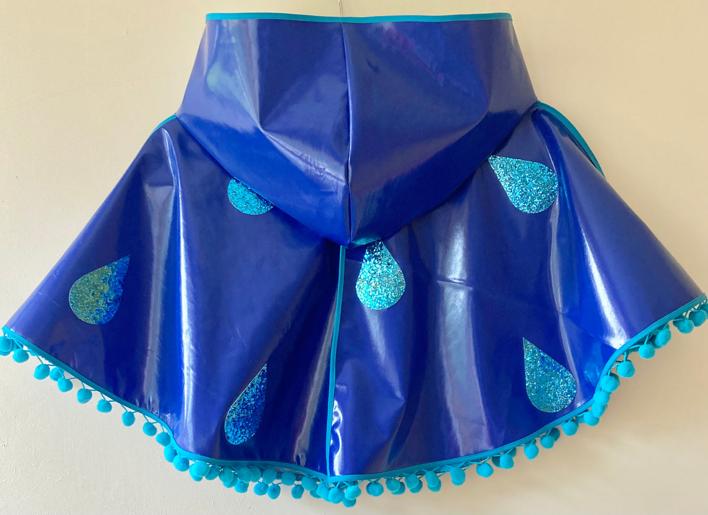 CYCLONE Blue cape, blue glitter raindrops & pompom trim