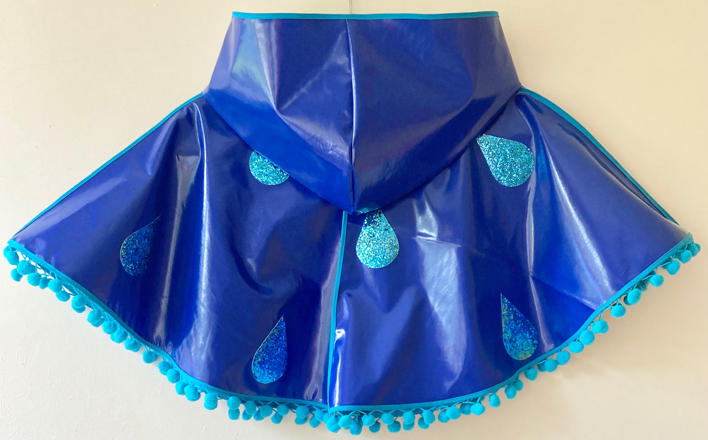 CYCLONE Blue cape, blue glitter raindrops & pompom trim