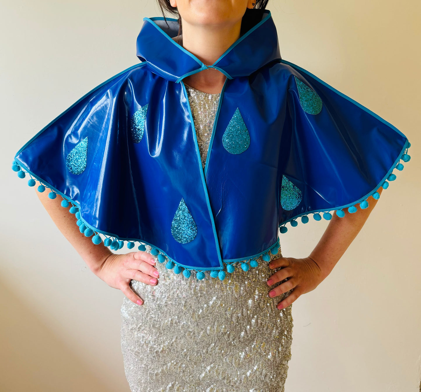 CYCLONE Blue cape, blue glitter raindrops & pompom trim