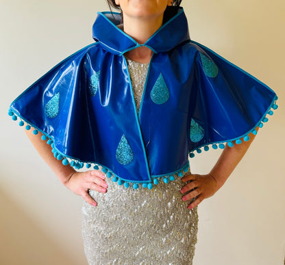 CYCLONE Blue cape, blue glitter raindrops & pompom trim