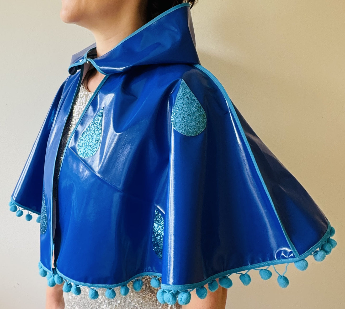 CYCLONE Blue cape, blue glitter raindrops & pompom trim