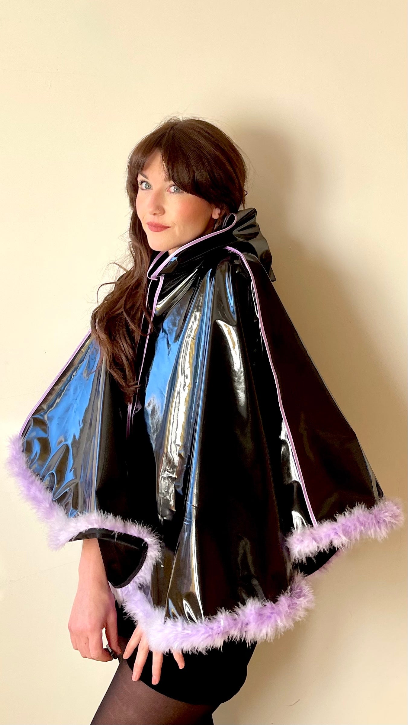 Black PVC 'CYCLONE' cape with lilac feather trim