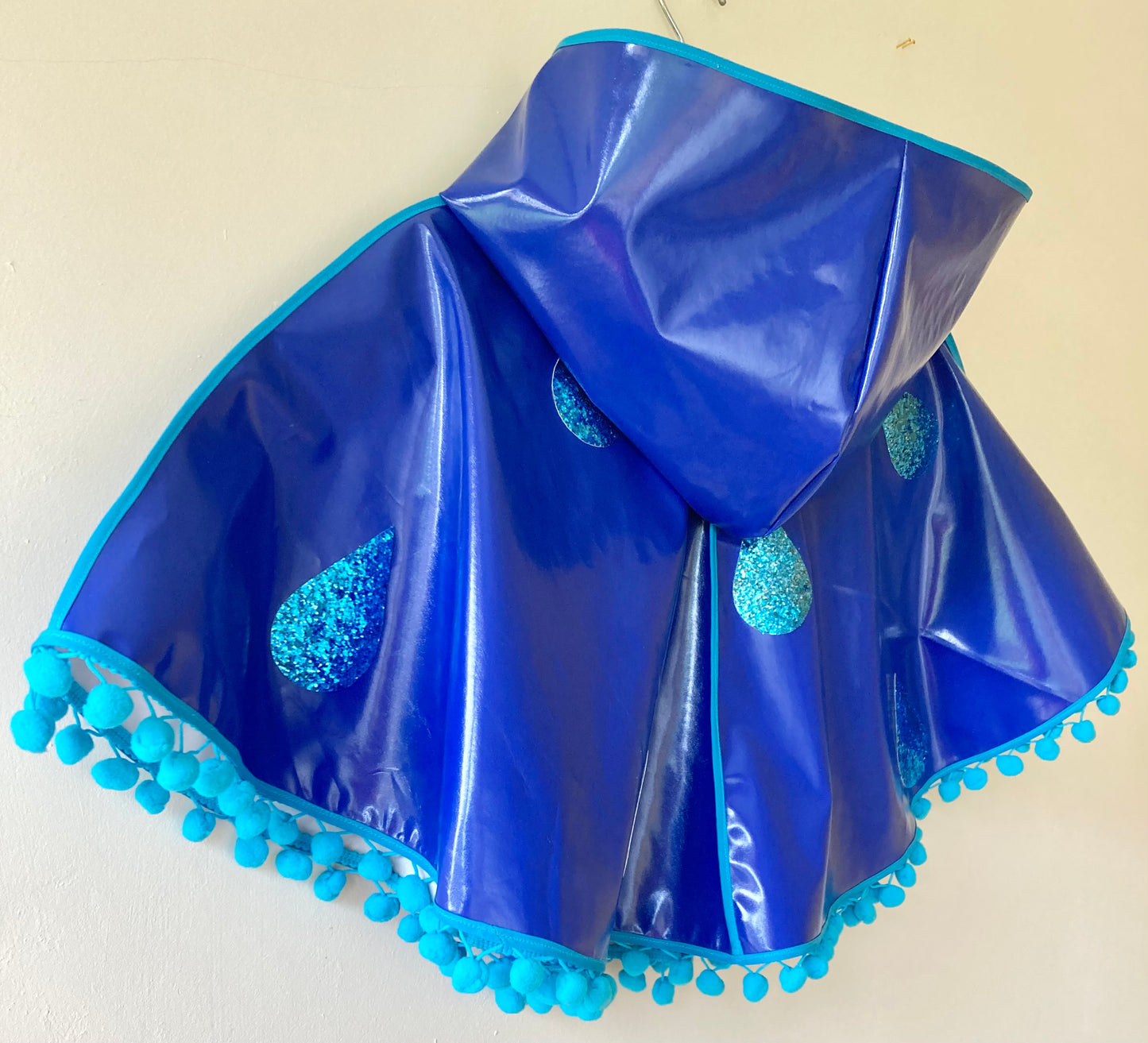 CYCLONE Blue cape, blue glitter raindrops & pompom trim